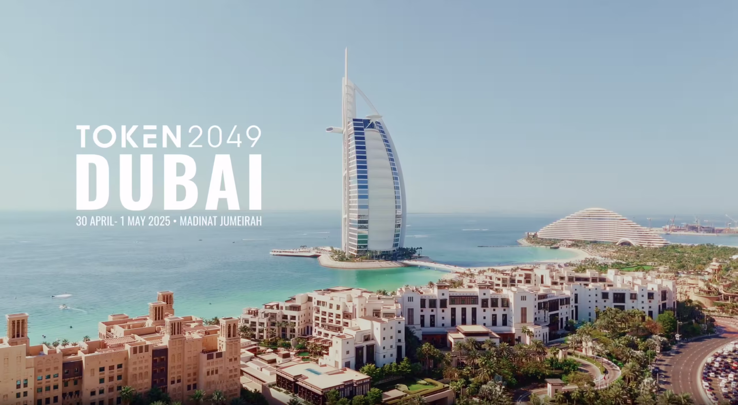TOKEN2049 Dubai 2025 promotional image showing Madinat Jumeirah and Burj Al Arab